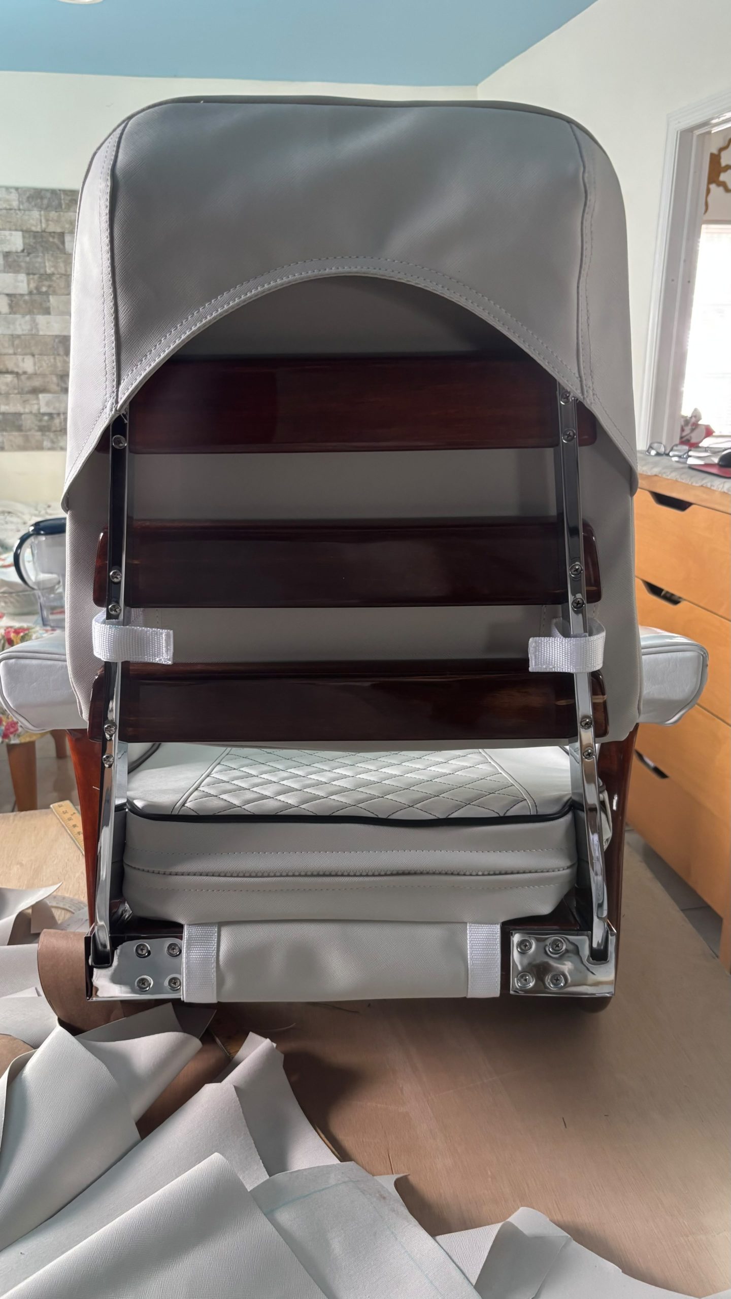 Image depicting a new custom upholstered Captain's Chair.