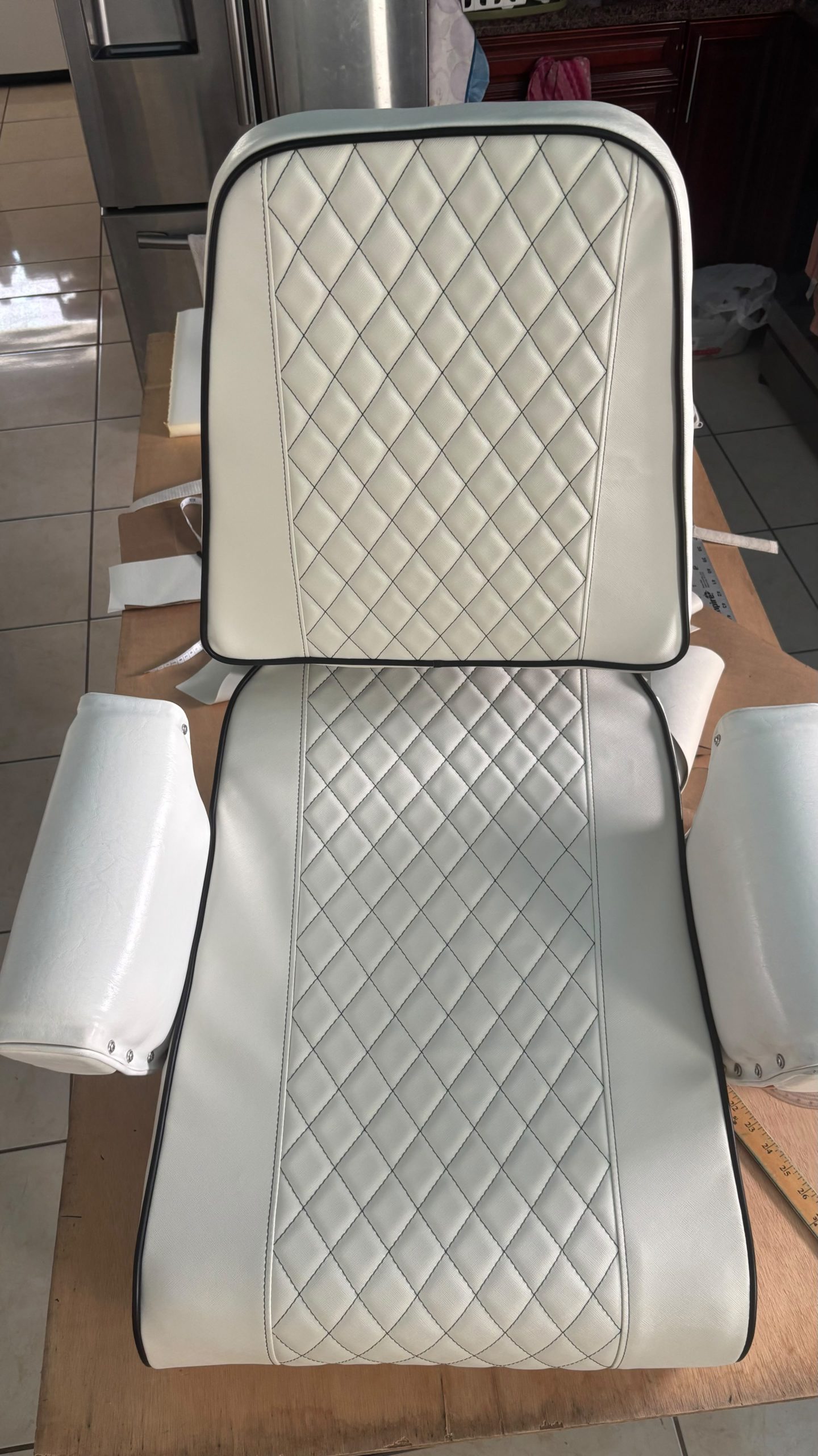 Image depicting a new custom upholstered Captain's Chair.