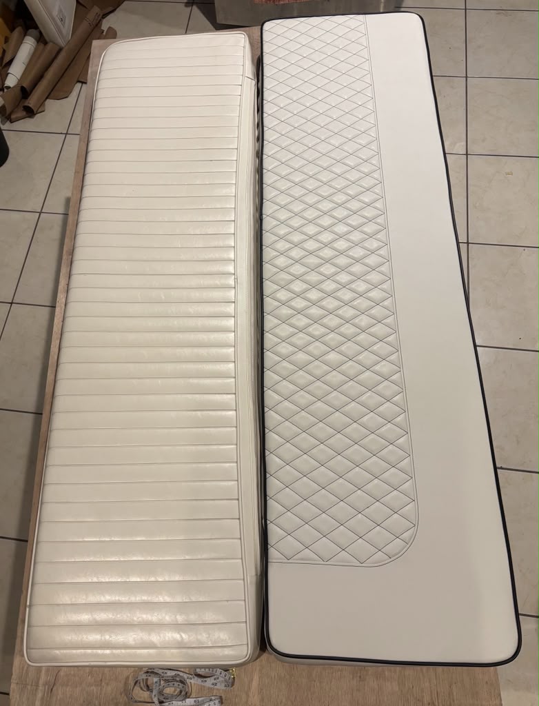 Image depicting old and new yacht cushions. On the left is an original old yacht cushion, while the right cushion is new and custom upholstered with diamond pleating.