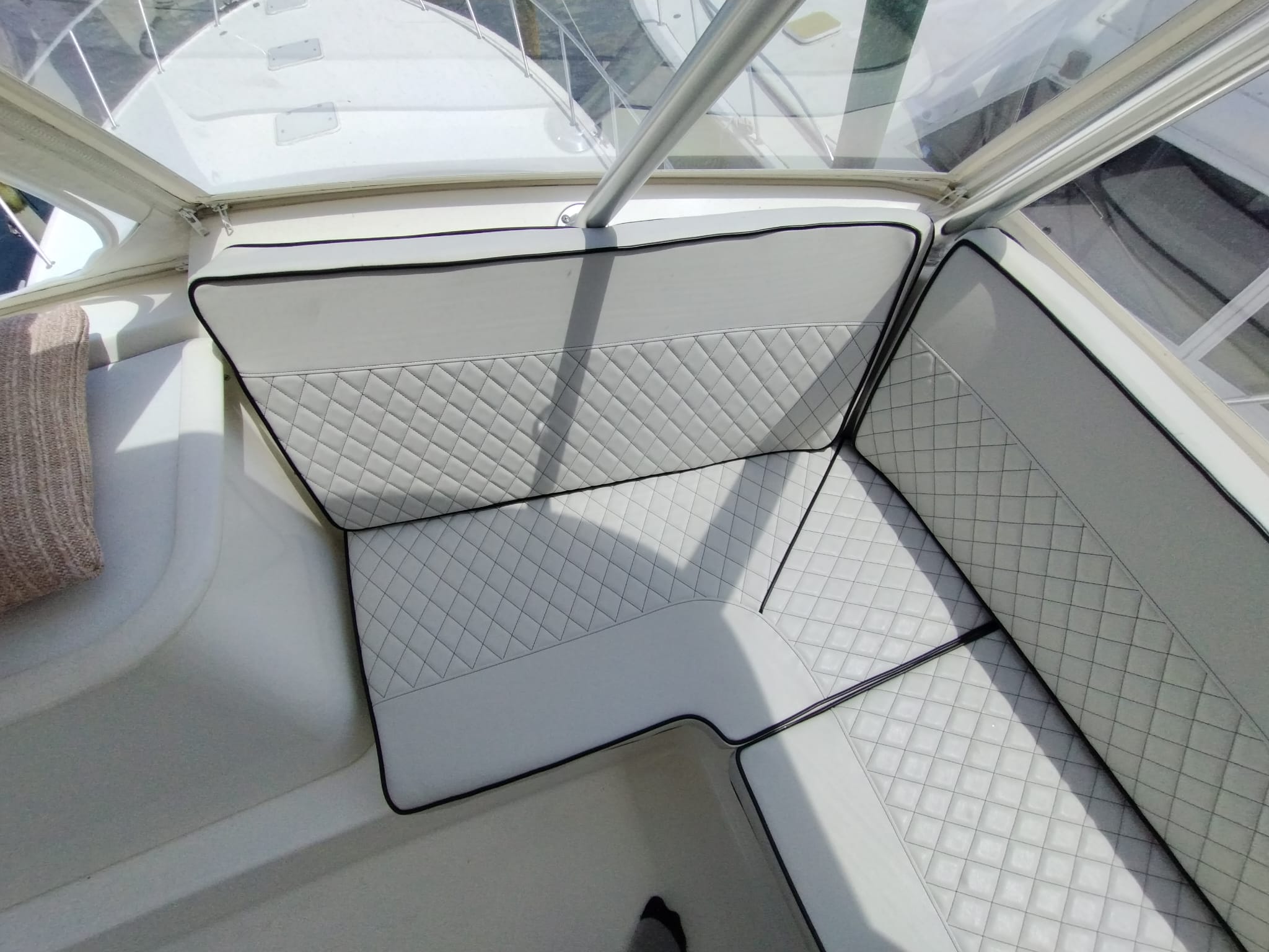 Image depicting custom upholstered yacht cushions installed on their yacht.