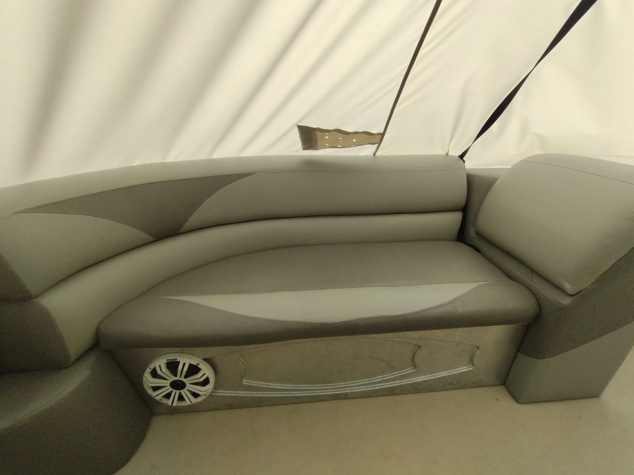 Newly upholstered boat seat cushions on the left side after marine upholstery restoration