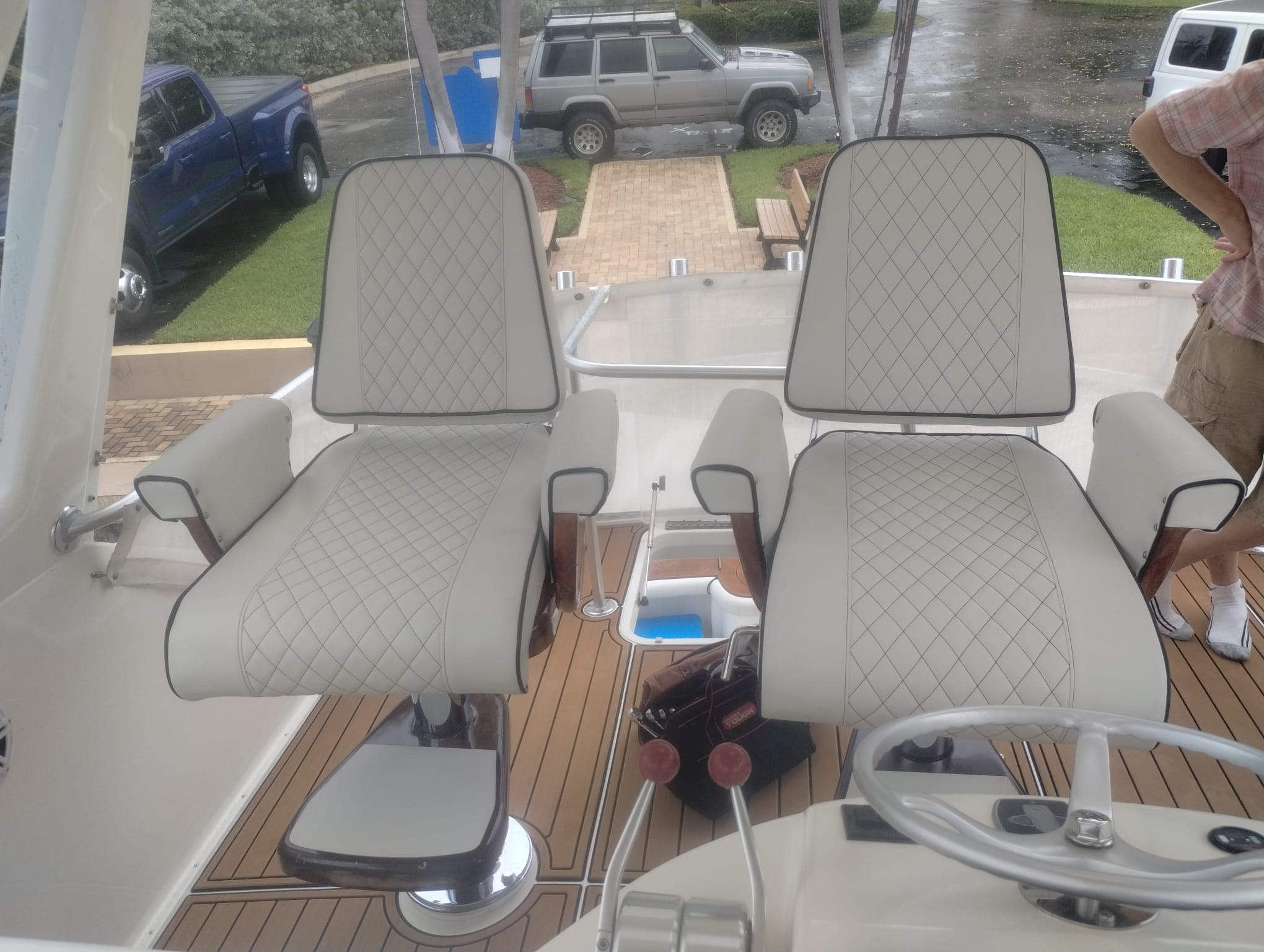 Two new captain's chairs with new upholstery from the front.