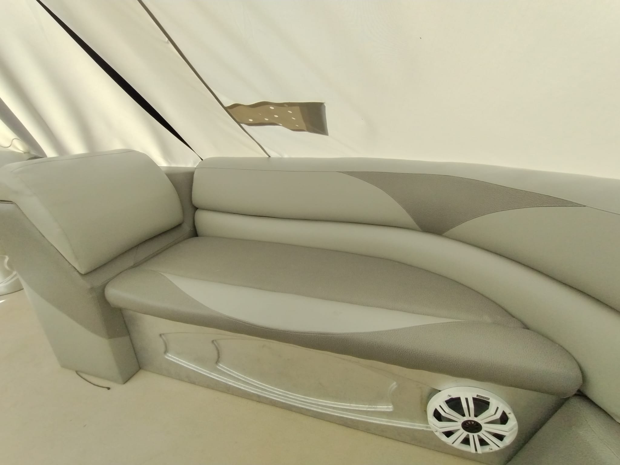 Newly upholstered boat seat cushions on the right side after marine upholstery restoration