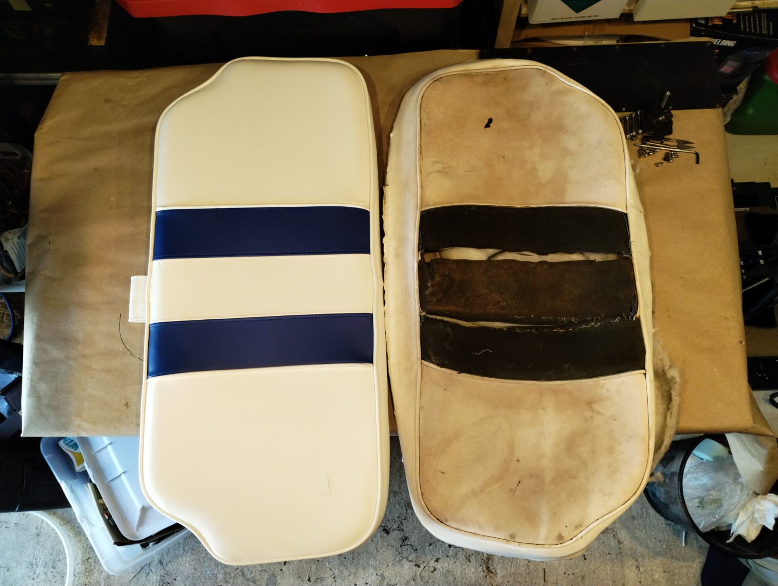 New white and navy boat seat back cushion next to old worn cushion with exposed padding