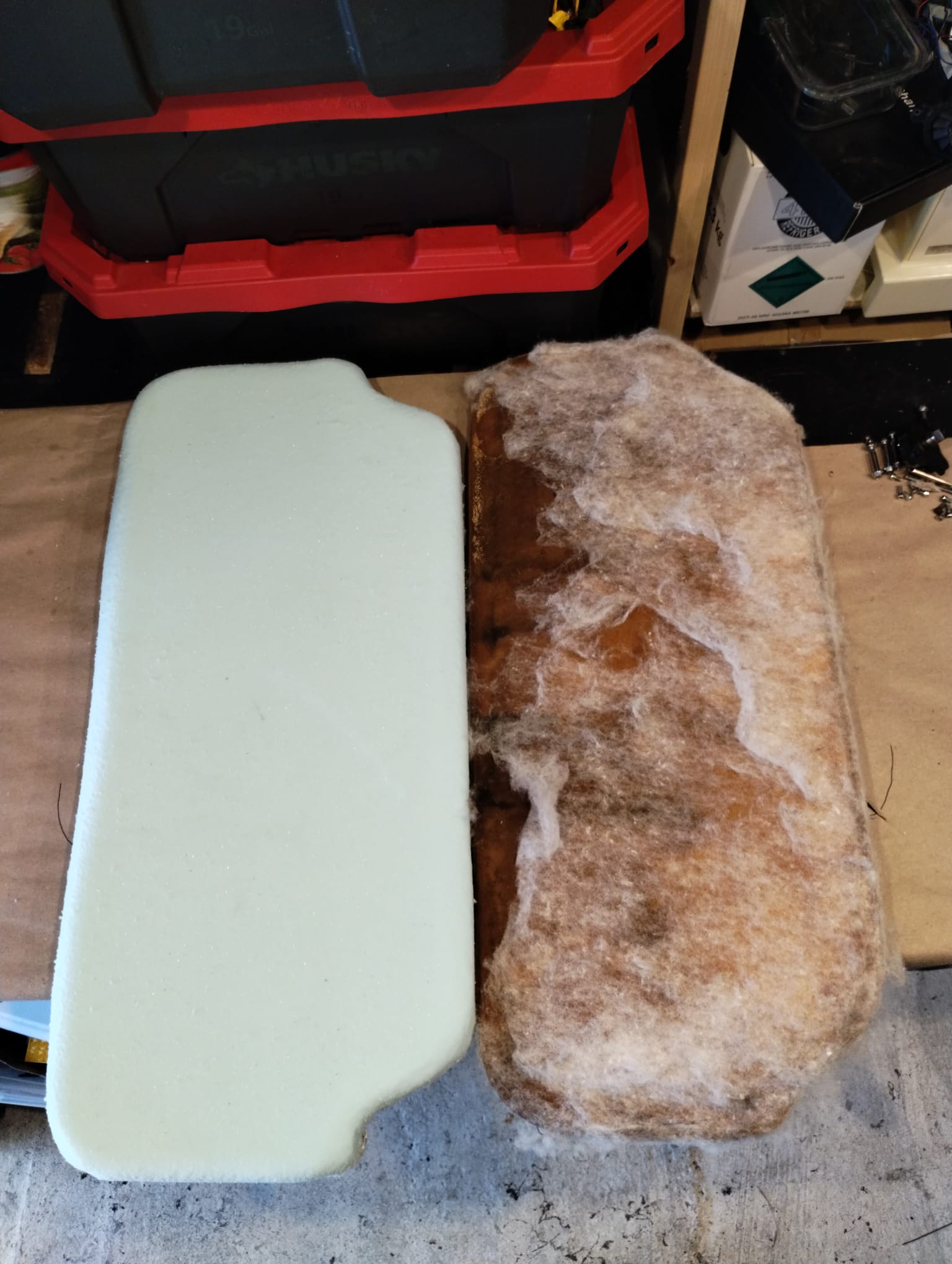 Rectangular boat cushion foam before and after replacement, moldy original next to new white foam