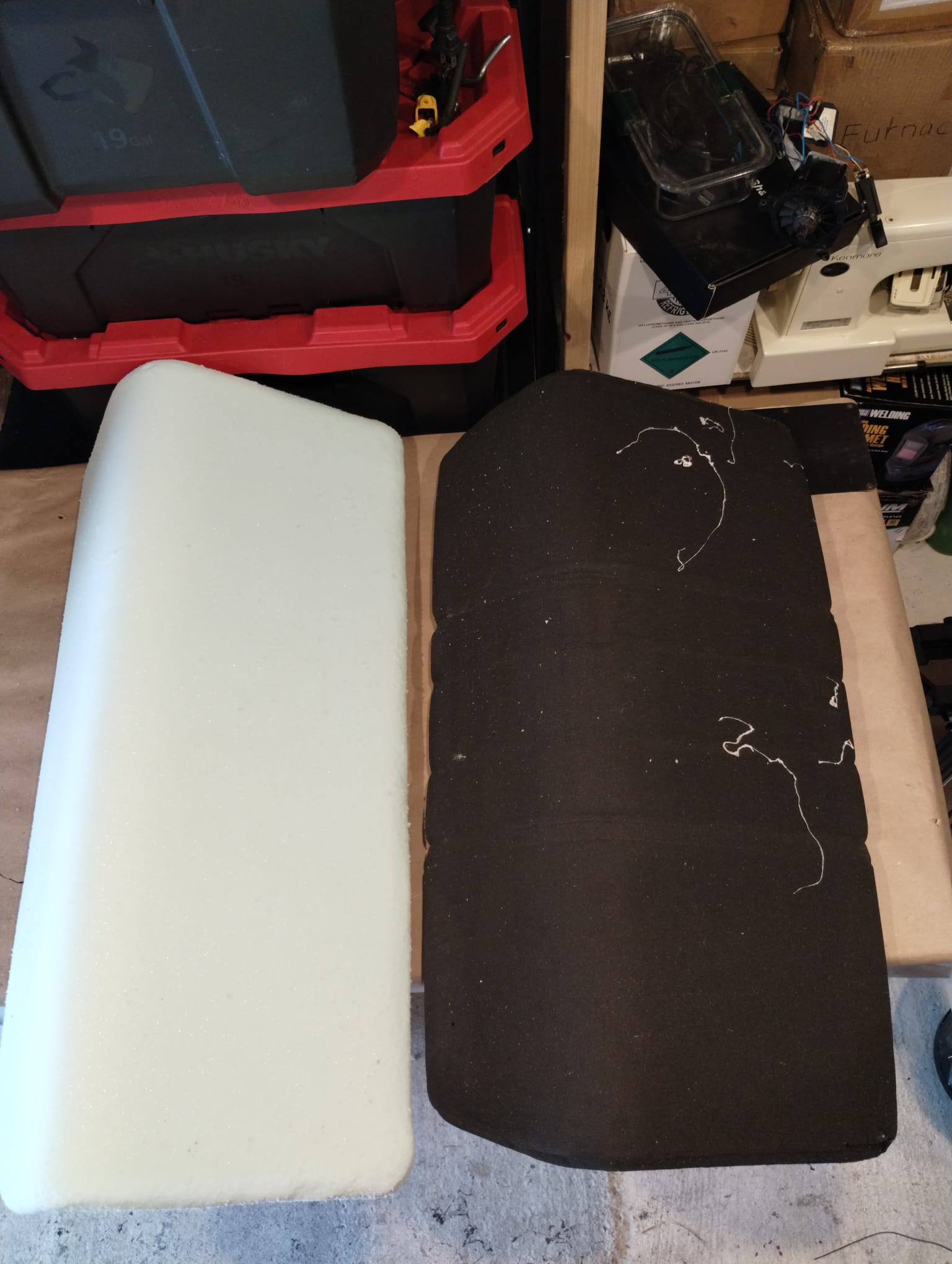 Corner detail of moldy boat foam beside new white marine-grade foam replacement