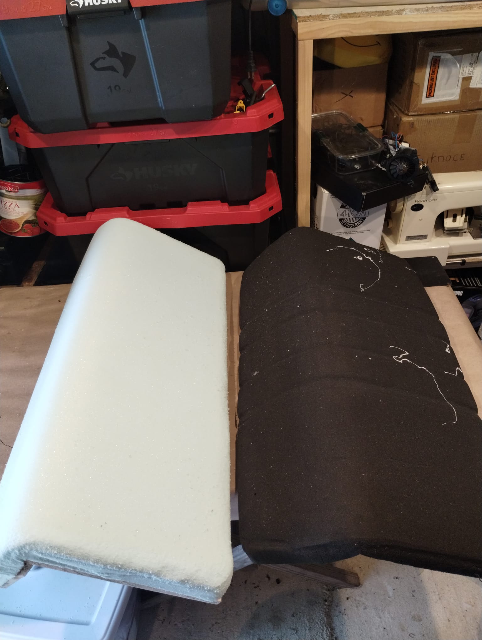 Close-up comparison of moldy boat cushion foam edge next to new white replacement foam