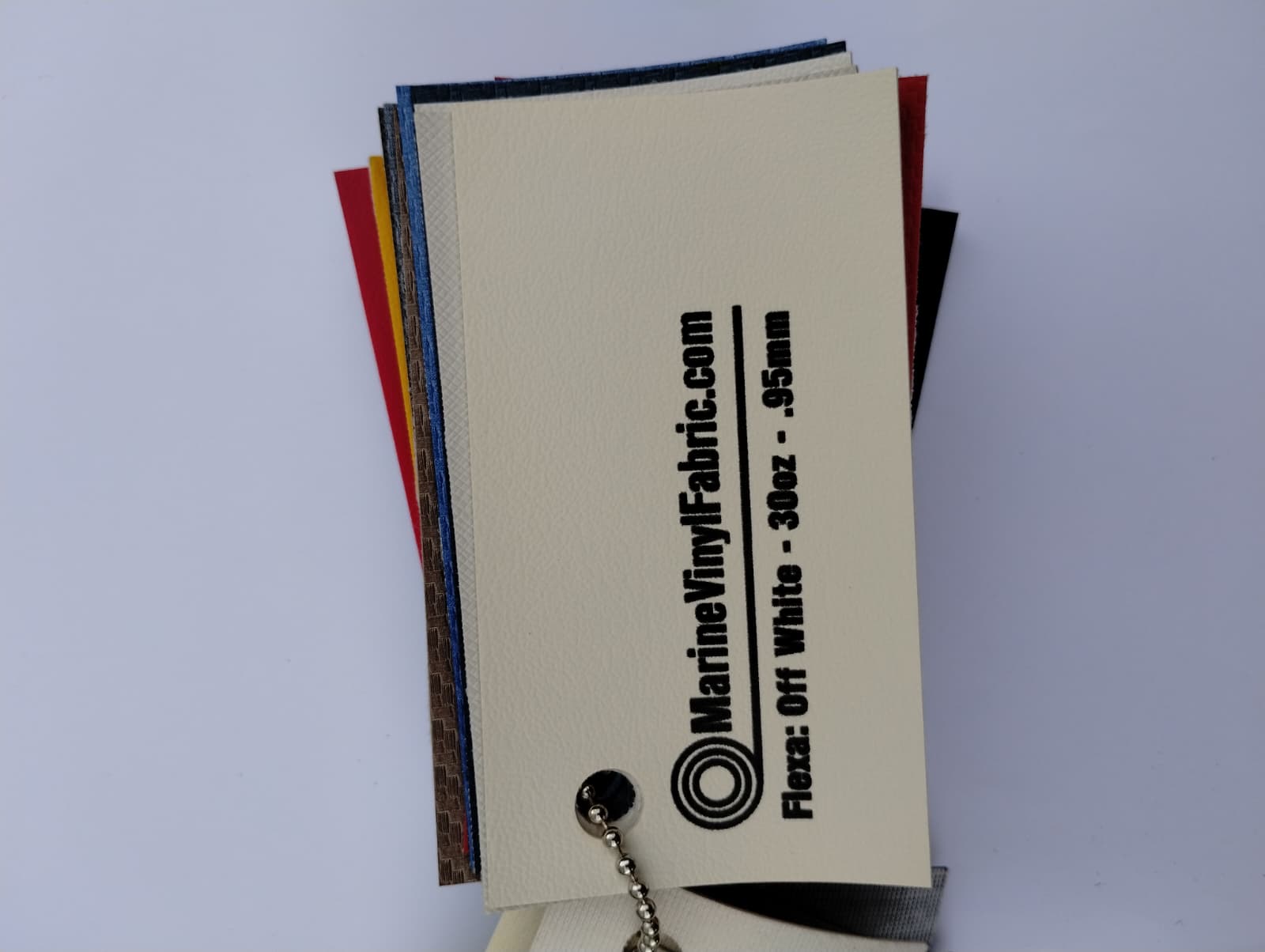 Off white Flexa marine vinyl upholstery fabric swatch on a sample ring, 30oz and 0.95mm marine grade