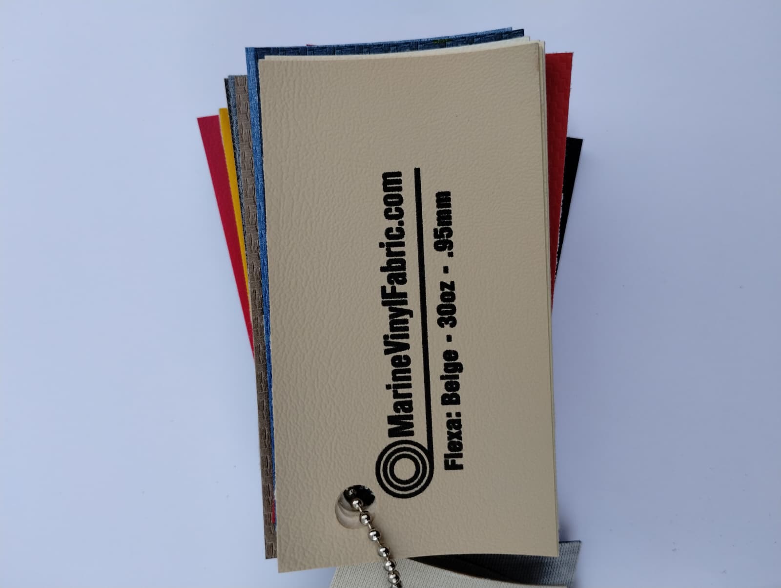 Beige Flexa marine vinyl upholstery fabric swatch on a sample ring, 30oz and 0.95mm marine grade