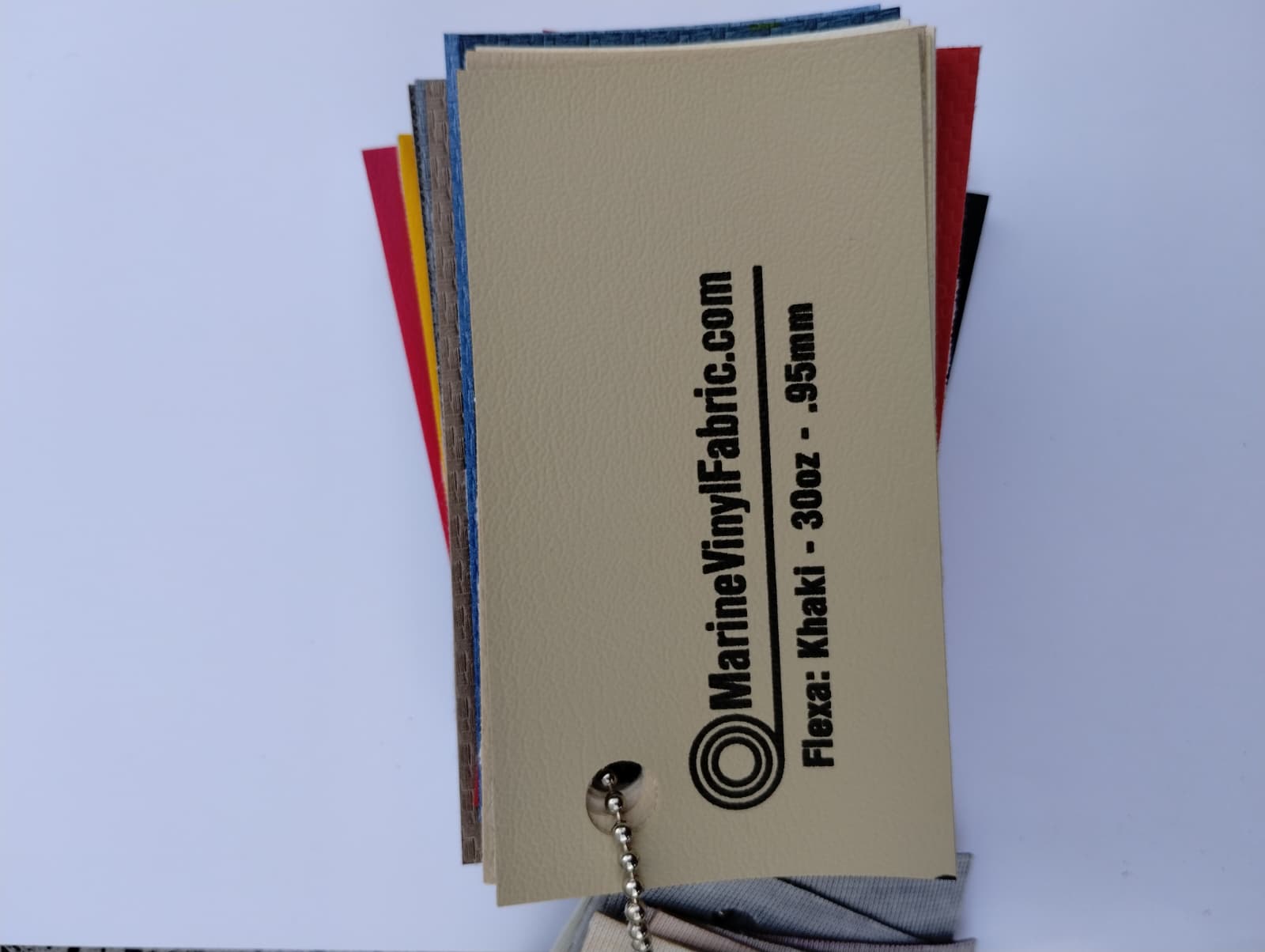 Khaki Flexa marine vinyl upholstery fabric swatch on a sample ring, 30oz and 0.95mm marine grade