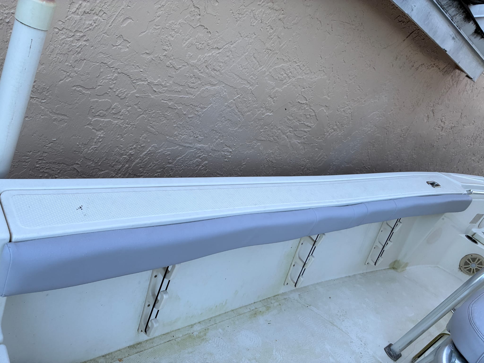 Close-up of the clean stitching on a custom-upholstered boat bolster cushion.